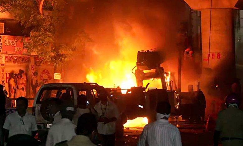 Nagpur, Mar 17 (ANI): Efforts underway to douse fire in vehicles that have been torched after tensions broke out following a dispute between two groups, at Mahal in Nagpur on Monday.