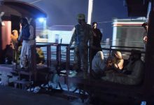 A soldier works to evacuate freed train passengers at the Mach railway station, which has been turned into a makeshift hospital, after Pakistani security forces freed nearly 80 passengers following a security operation against armed militants who ambushed the train in the remote mountainous area, in Mach, southwestern Balochistan province on March 11, 2025. Pakistani troops freed dozens of train passengers taken hostage by armed militants of the Baloch Liberation Army (BLA), a separatist group behind rising violence in the province which borders Afghanistan and Iran, after gunmen forced a train to a halt in a remote, mountainous area of Balochistan province in the afternoon of on March 11, 2025.