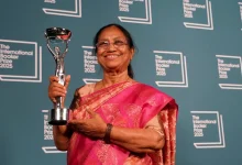 "Kannada writer Banu Mushtaq holds her International Booker Prize for 'Heart Lamp,' celebrating Indian literature's global milestone."