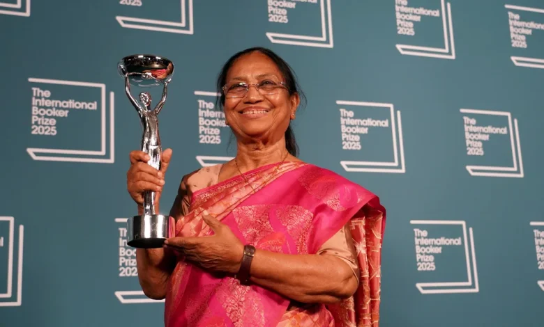 "Kannada writer Banu Mushtaq holds her International Booker Prize for 'Heart Lamp,' celebrating Indian literature's global milestone."