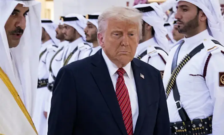 Qatar’s Emir Sheikh Tamim bin Hamad al-Thani (L) receives US President Donald Trump in the Qatari capital Doha.