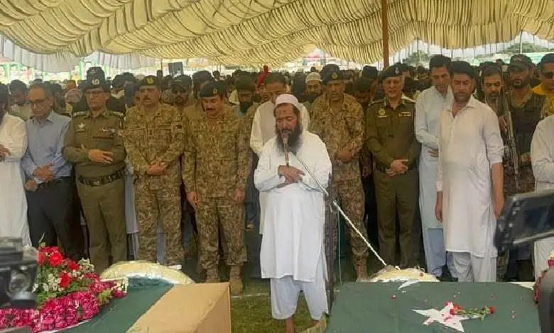 Serving members of the Pakistan Army attending the funeral - of killed terrorists - with top LeT commander Abdul Rauf.