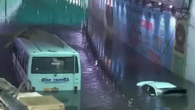 Stranded vehicles submerged in flooded Delhi underpass during severe overnight rain, highlighting widespread urban inundation. | Image: DD News