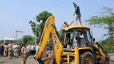 Farmers protest pipeline project at Dhatarwadi Dam in Rajula; some climb JCBs, detained by police amid escalating tensions.