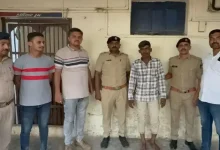 Jamnagar railway police at crime scene where disabled man was found dead after being thrown from a moving train.
