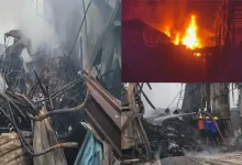 Smoke and flames rise from burning scrap godowns in Vapi’s Dungari Faliya, as fire crews battle the intense blaze.