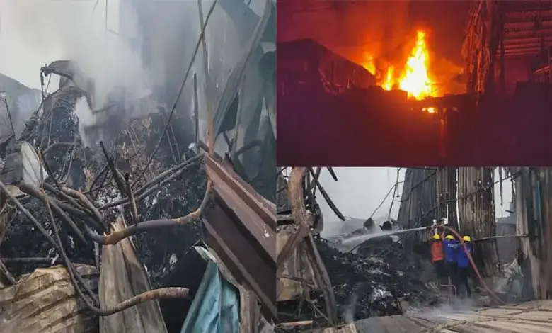 Smoke and flames rise from burning scrap godowns in Vapi’s Dungari Faliya, as fire crews battle the intense blaze.
