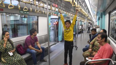 Mumbai Metro Aqua Line station with commuters using free Wi-Fi to stay connected amid mobile network outages.