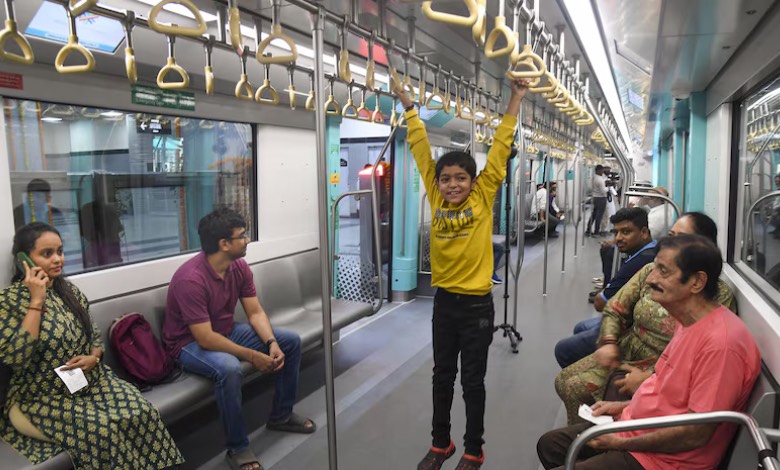 Mumbai Metro Aqua Line station with commuters using free Wi-Fi to stay connected amid mobile network outages.