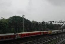 Heavy monsoon rains in Mumbai causing waterlogging, with dark clouds and lightning overhead.