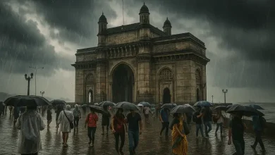 Mumbai skyline during pre-monsoon showers with overcast skies and light rainfall.
