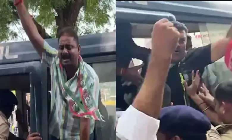 Congress rally in Rajkot demanding justice for TRP fire victims, with heavy police presence and public protest.