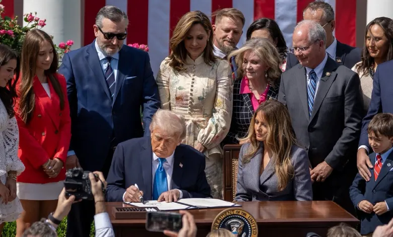 President Trump signs the "Take It Down Act" alongside First Lady Melania Trump, addressing non-consensual intimate content.