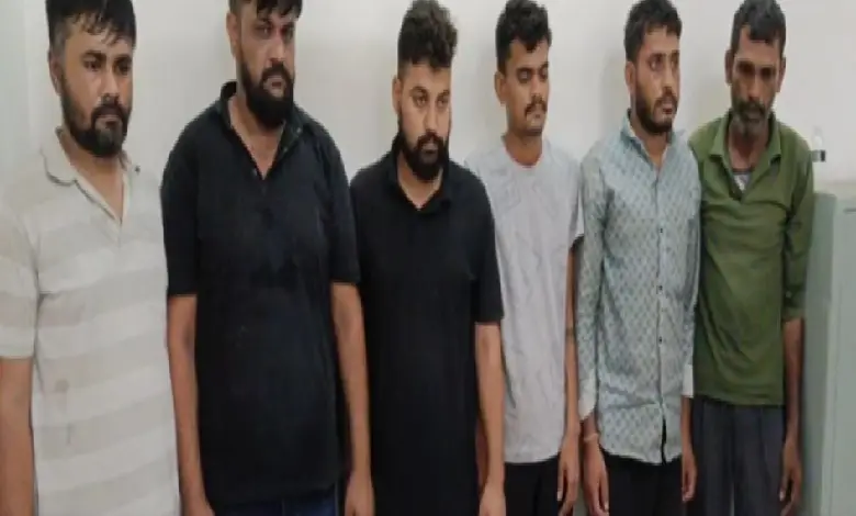 Jamnagar police bust fake liquor factory; 6 arrested and illegal alcohol pouches seized during raid in Navy Moda village.