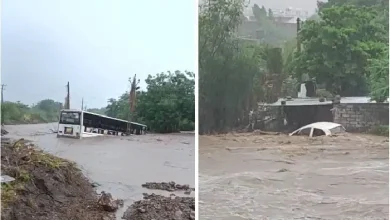 Flooded roads and stranded bus in Amreli district amid heavy monsoon rains in Gujarat, causing local disruptions.