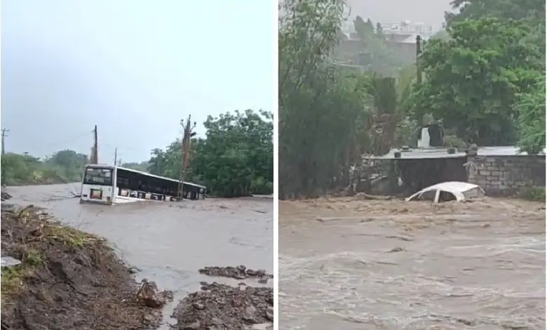 Flooded roads and stranded bus in Amreli district amid heavy monsoon rains in Gujarat, causing local disruptions.