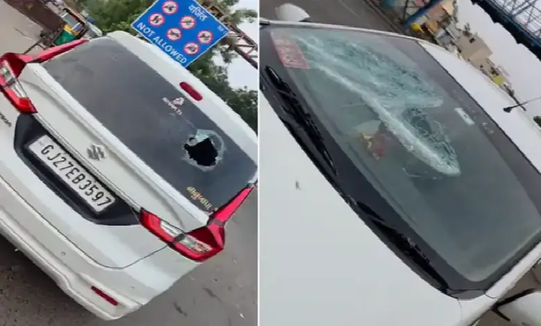 Taxi driver breaks car window near CTM Express Highway during dispute over passengers; incident caught on CCTV footage.