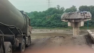 Collapsed Gambhira Bridge over Mahi River with rescue teams searching for victims after deadly accident in Gujarat.