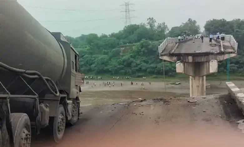 Collapsed Gambhira Bridge over Mahi River with rescue teams searching for victims after deadly accident in Gujarat.