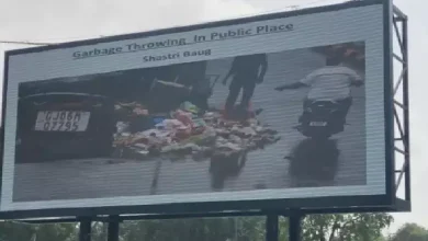 LED screen in Vadodara displaying photo of littering offender as part of digital cleanliness and public shaming campaign.