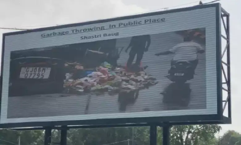 LED screen in Vadodara displaying photo of littering offender as part of digital cleanliness and public shaming campaign.