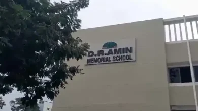 Vadodara police at DR Amin School after bomb threat e-mail; bomb squad conducts search for RDX.