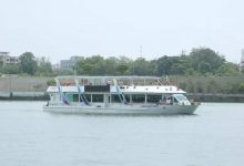 Sabarmati Riverfront cruise in Ahmedabad decorated for Janmashtami celebrations with festive lights and seating.
