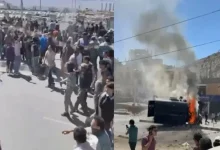 Angry protesters clashed with the police in Leh city of Ladakh this morning, pelting stones at officials and even burning down a police vehicle.