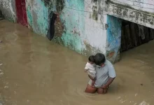 The wave of chaos and destruction across the national capital continued on Thursday as intermittent rains and the swelling Yamuna River left vast low-lying areas submerged.