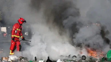 Protesters blocked roads, set blazes and were met with volleys of police tear gas on Wednesday in Paris and elsewhere in France.