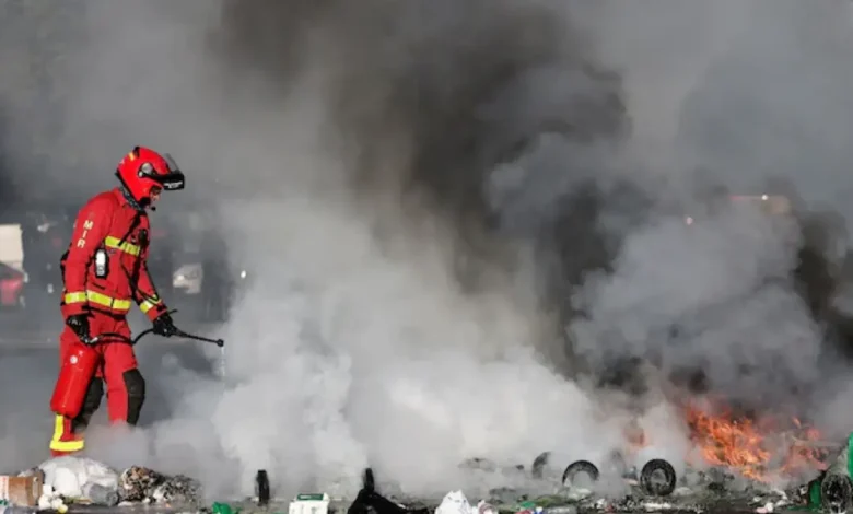 Protesters blocked roads, set blazes and were met with volleys of police tear gas on Wednesday in Paris and elsewhere in France.