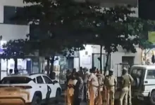 Dressed in military-style uniforms and armed with guns, a gang of three masked men stormed into a State Bank of India branch at Karnataka's Chadachan town on Tuesday evening and looted gold ornaments worth Rs 20 crore and Rs 1 crore cash.