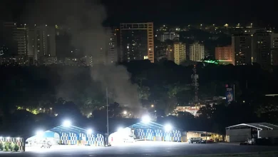 Airplanes roared overhead and explosions shook the streets of Caracas early Saturday, with a thick plume of smoke rising over the Venezuelan capital as power went out near a major military base.