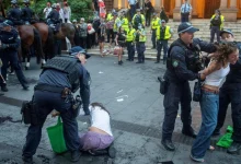 Police officers remove demonstrators gathered at Town Hall Square to protest against Israeli President Isaac Herzog's state visit to Australia. | Photo Credit: Reuters