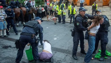 Police officers remove demonstrators gathered at Town Hall Square to protest against Israeli President Isaac Herzog's state visit to Australia. | Photo Credit: Reuters
