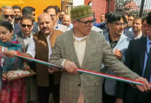 Jammu and Kashmir Chief Minister Omar Abdullah holds the ribbon during the inauguration of the 'Know Your Artisan' programme in Srinagar. (Photo IANS)
