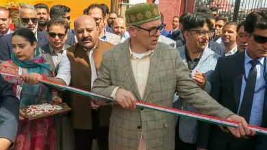 Jammu and Kashmir Chief Minister Omar Abdullah holds the ribbon during the inauguration of the 'Know Your Artisan' programme in Srinagar. (Photo IANS)