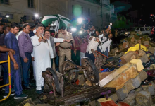 Karnataka Deputy Chief Minister DK Shivakumar visits the site of a wall collapse following heavy rain. (Image: PTI)