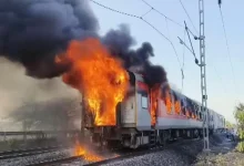 Flames and smoke billow after a fire broke out in an AC coach of the Thiruvananthapuram-Hazrat Nizamuddin Rajdhani Express i