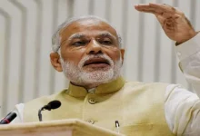 PM Modi in a yellow suit