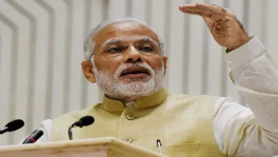 PM Modi in a yellow suit
