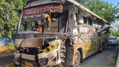 Damaged luxury bus and truck on the Vadodara-Ahmedabad Expressway in Anand district after the collision