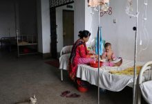 Health worker administering measles vaccine to child during Bangladesh outbreak response