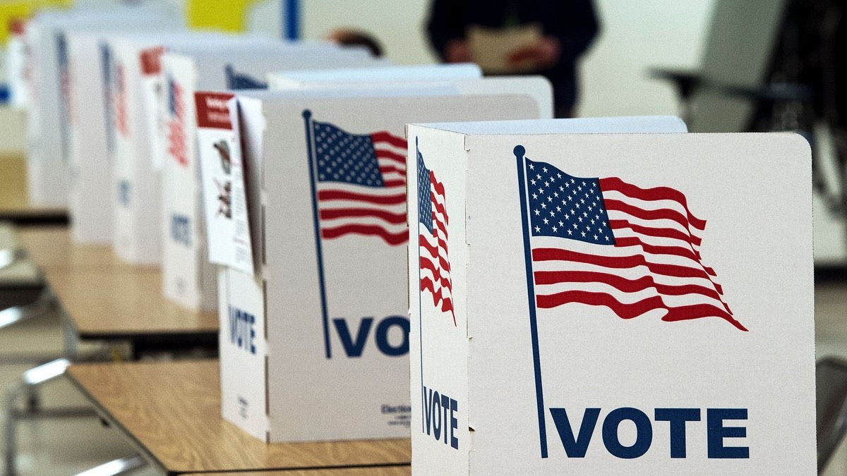 Voters casting ballots at a polling station during the US midterm elections